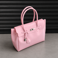Side view of the Jelly Firkin Blush pink bag with padlock clasp