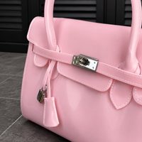 Jelly Firkin Blush pink bag detail with white stitching and padlock clasp