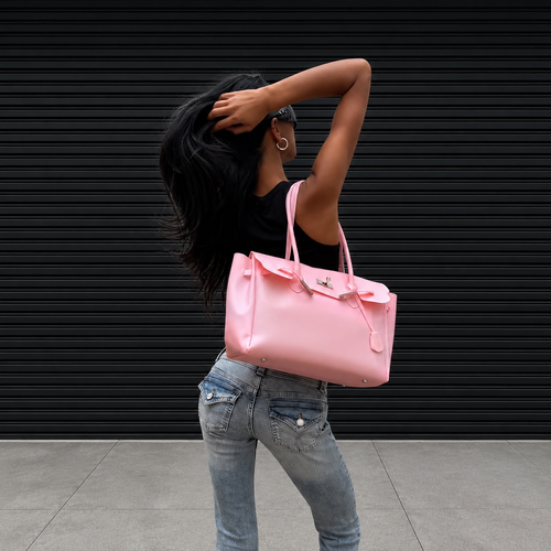 Model wearing the Jelly Firkin Blush pink shoulder bag with jeans